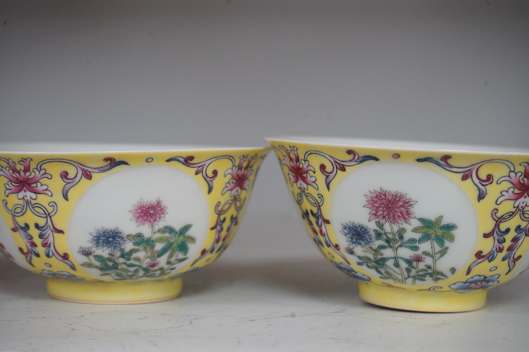 A pair of Chinese yellow ground medallion bowls, 13cm diameter